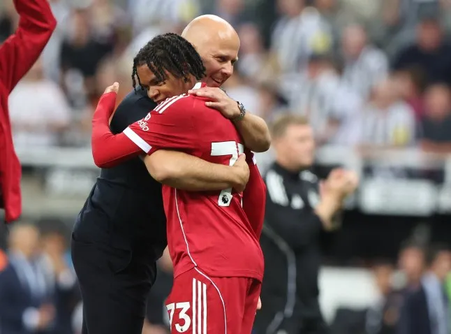 Rio Ngumoha celebrated with Liverpool manager Arne Slot after his astonishing Premier League debut